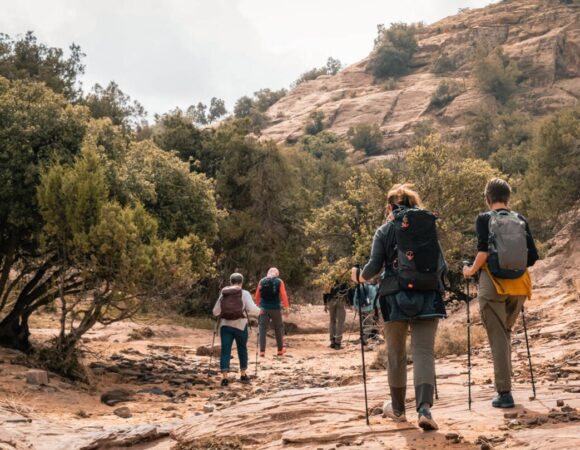 People with hiking sticks on Shaq Alreesh hike in Dana nature reserve