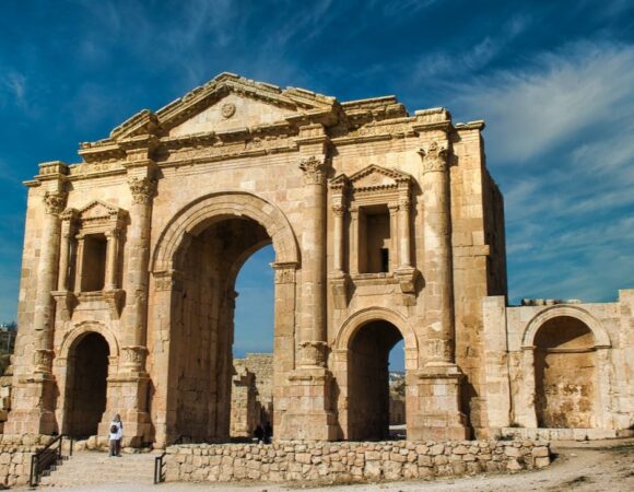 Hadrian's arch in Jerash with some people