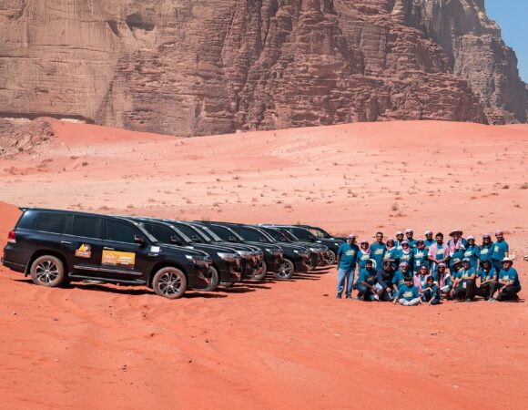 all 4x4 lined up in the wadi rum desert with guests from Jordan self drive road trip